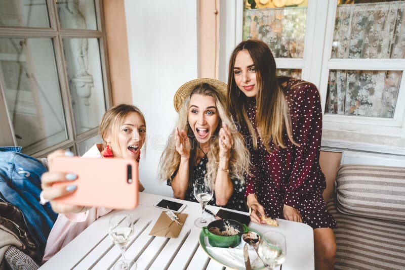 Three girls at the table stock image. Image of group - 139913111