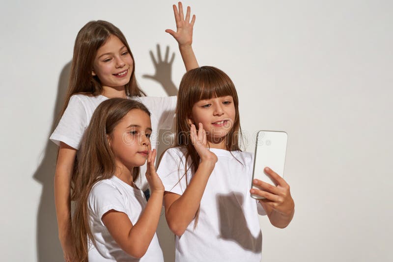 Three Girls Waving Hands during Taking Selfie Stock Image - Image of ...