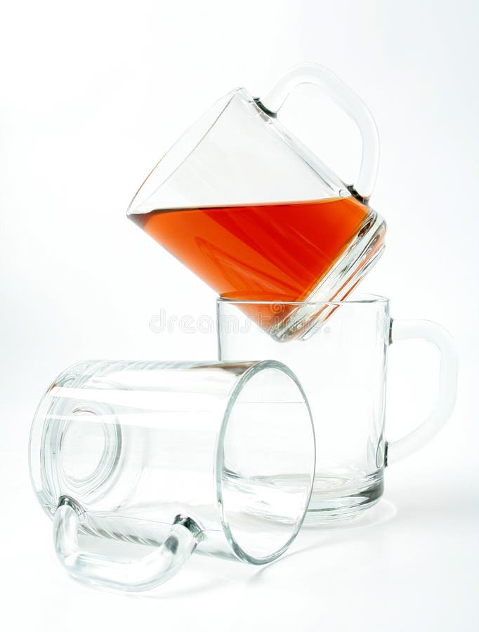 Three glass mugs and black tea