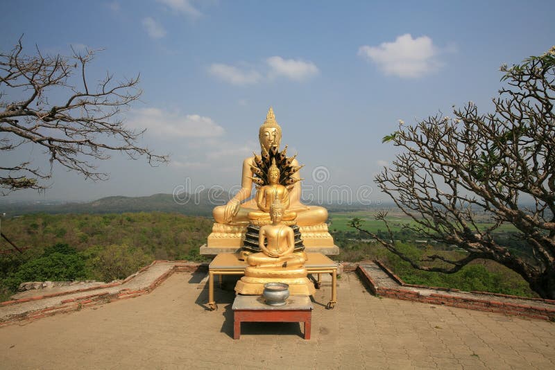 Three Gold Buddha Statues Located Near the Cliff Stock Image Image of