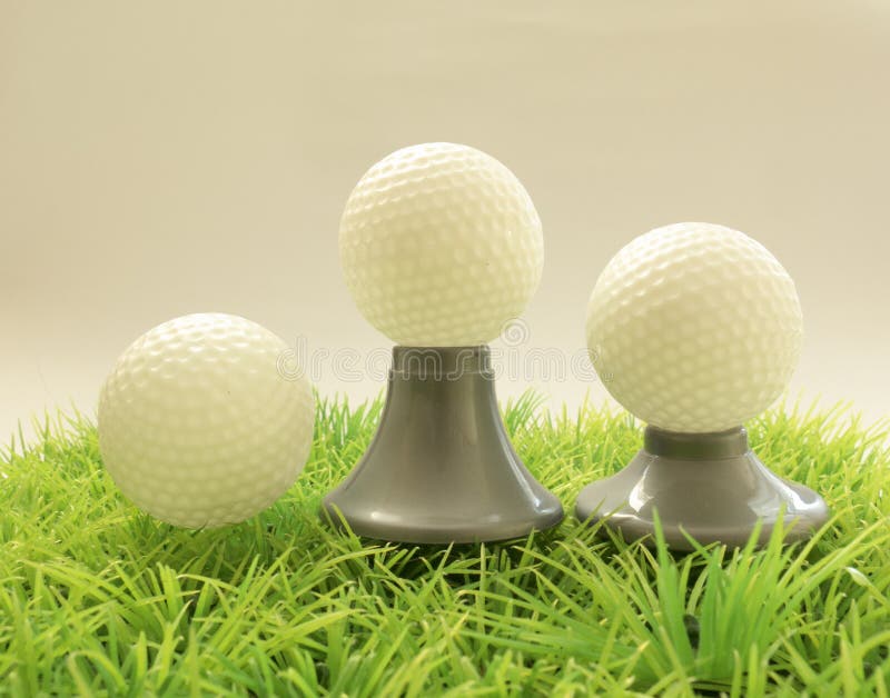 Three Golf Ball On Different Supports , Tee On Grass Stock Image Image of golfing, hobbies