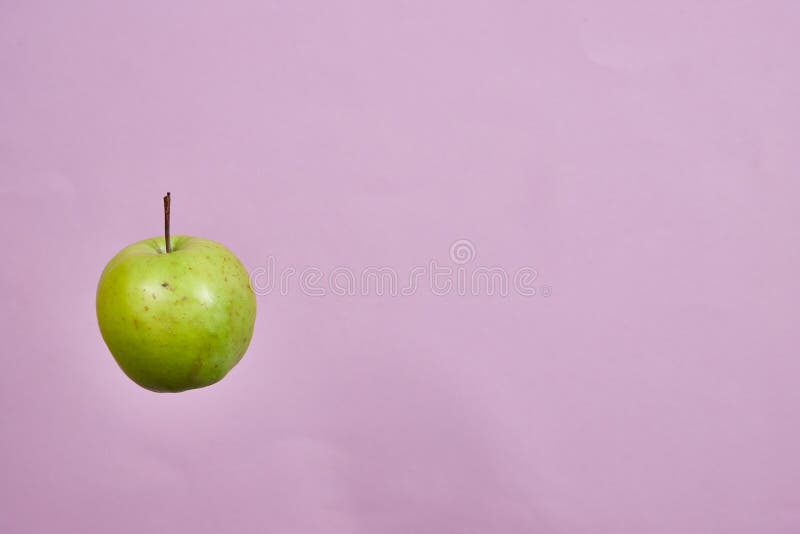 Three Green Apples Spinning on a Pink Background Stock Image Image of