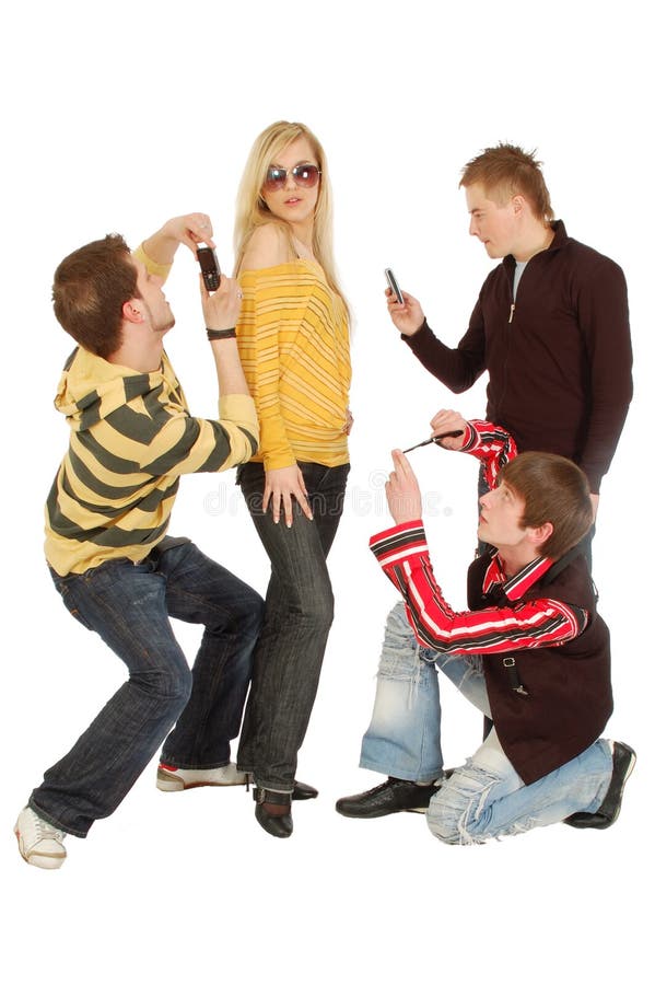 Three guys make photo of a girl by a mobile stock photography Three guys make photo of a girl by a mobile stock photography