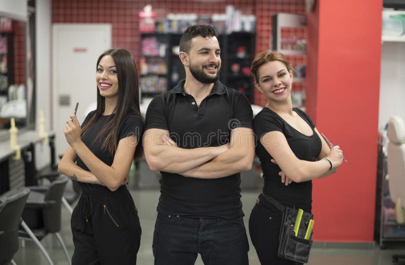 Three Hairdressers Posing In Barber Shop Stock Image Image Of
