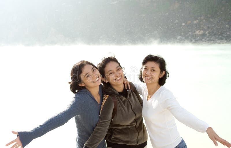 Three happy asian sisters