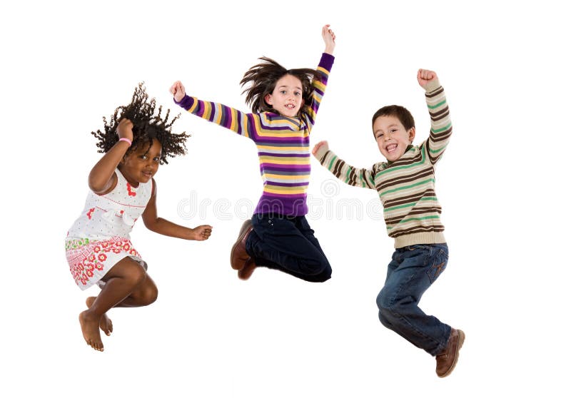 Three happy children jumping at once on a white background