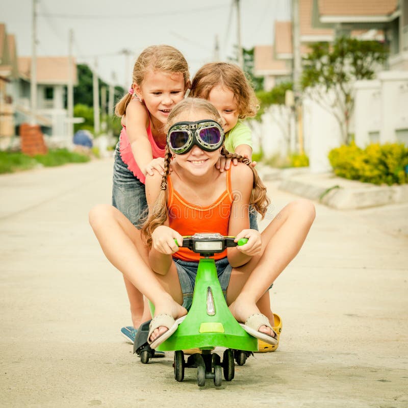 Three happy children playing on the road stock photography Three happy children playing on the road stock photography