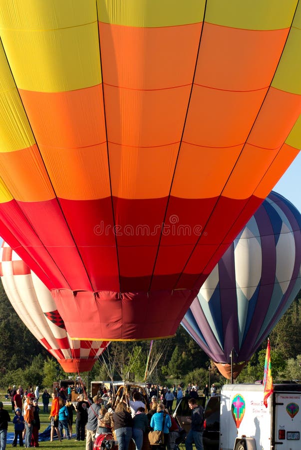 Three Hot Air Balloons And Crowd At Bend Oregon royalty free stock images Three Hot Air Balloons And Crowd At Bend Oregon royalty free stock images
