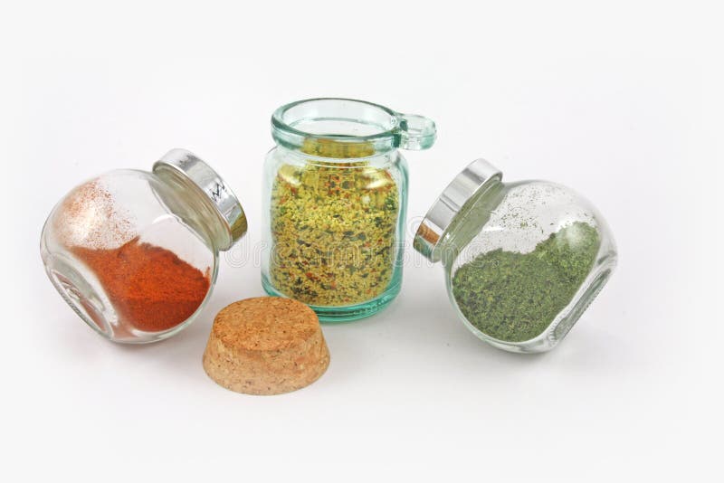 Three jars with spices and herbs