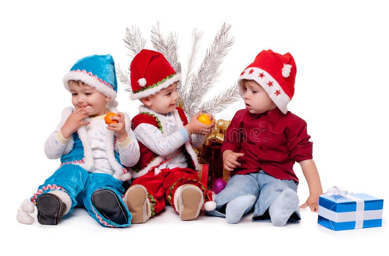 Three kids in Santa hats