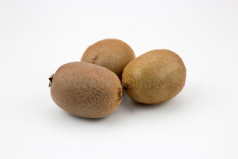 Three kiwi fruits on isolated background royalty free stock photo