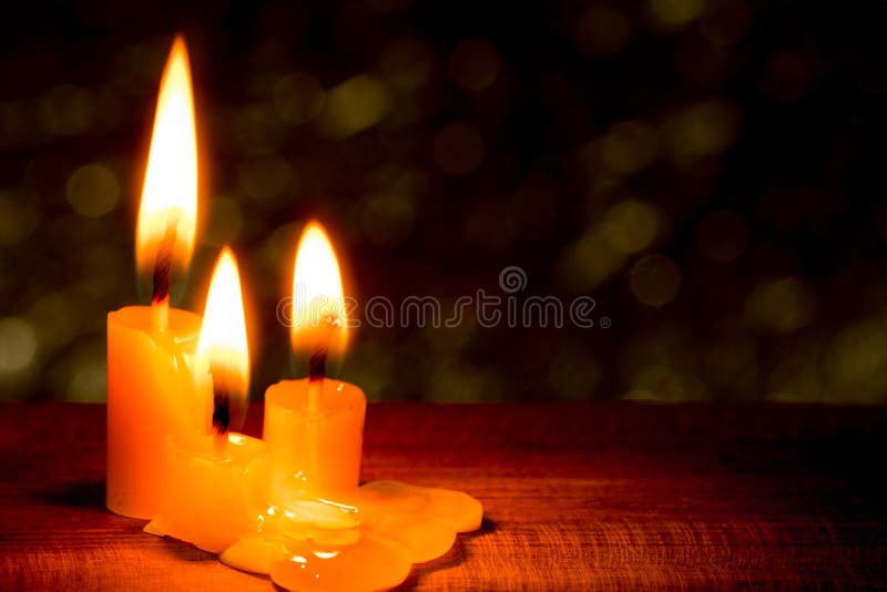 Three light candle burning stock images