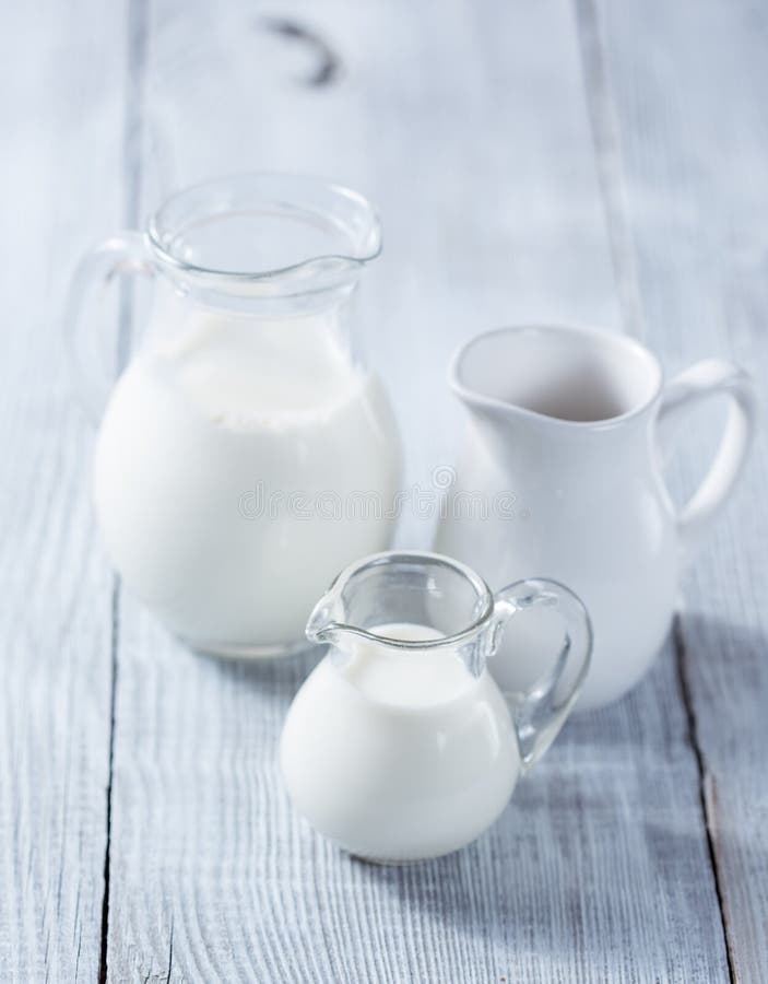 Three milk jars stock photos