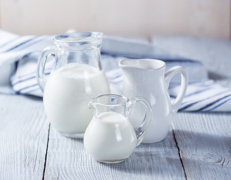 Three milk jars stock photos