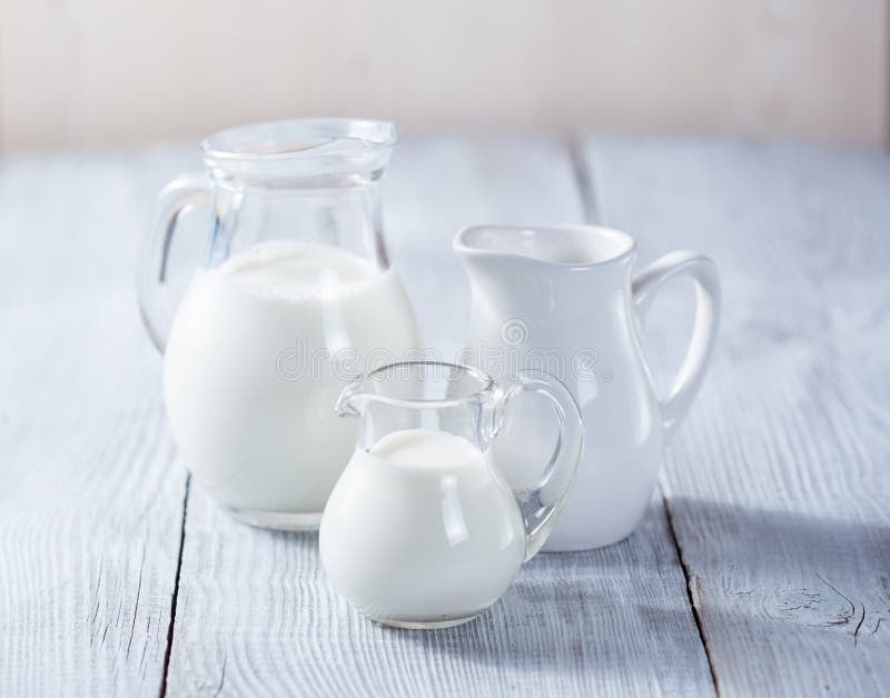 Three milk jars stock photography
