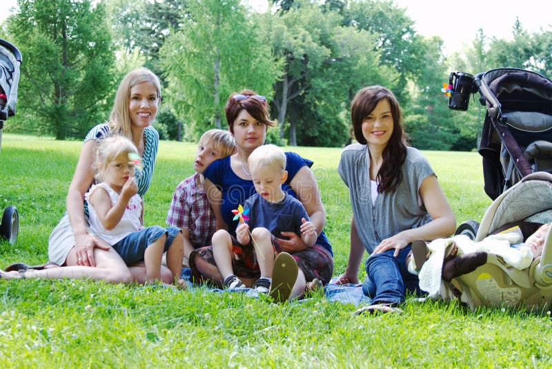 Three Moms and four children at park