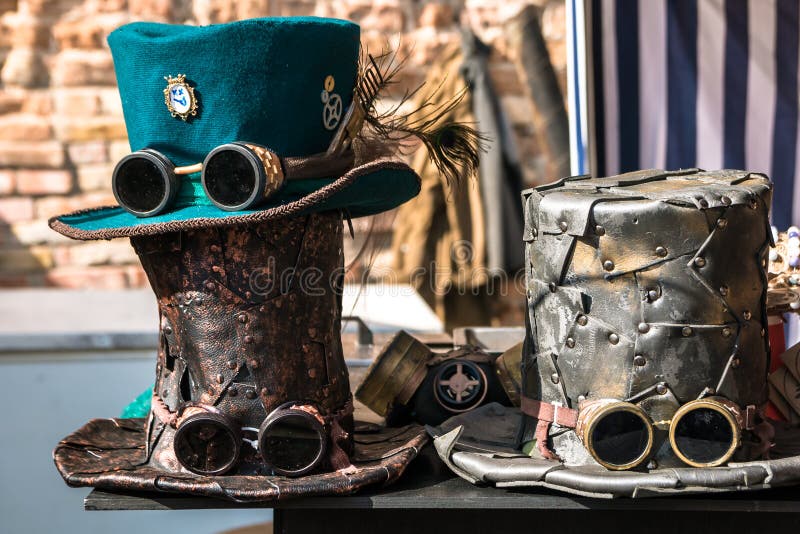 Three multi-colored steampunk hats. In the sunlight.