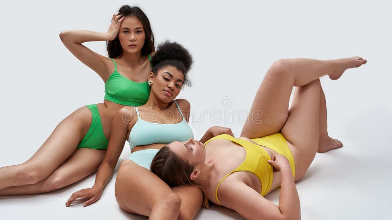 Three Young Women with Different Body Shapes in Colorful Underwear Posing  Together Isolated Over Light Background Stock Photo - Image of beautiful,  isolated: 213993590