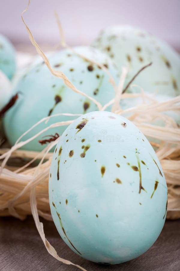 Three natural blue Easter eggs in a basket stock photos