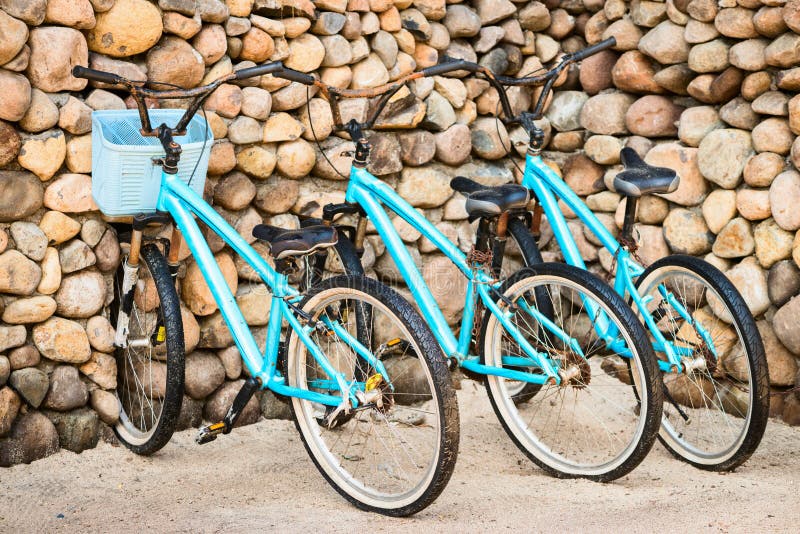 Three old, rusty blue bicycles stock photo