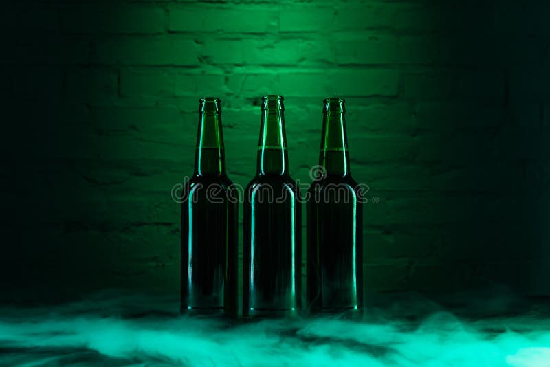 Three Open Green Beer Bottles and Smoke in Green Stock Photo Image of