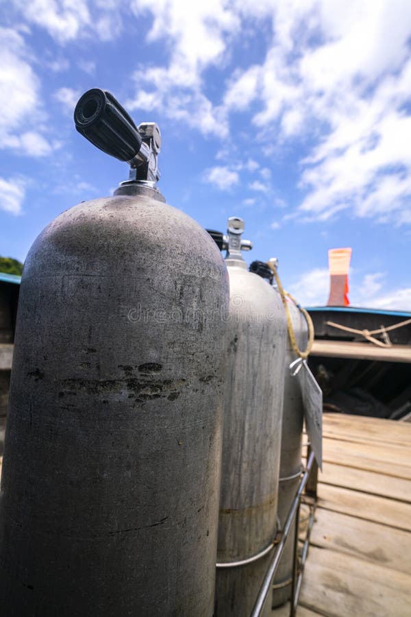A Three Oxygen Tanks for Scuba Diving Ready with Blue Sky Background