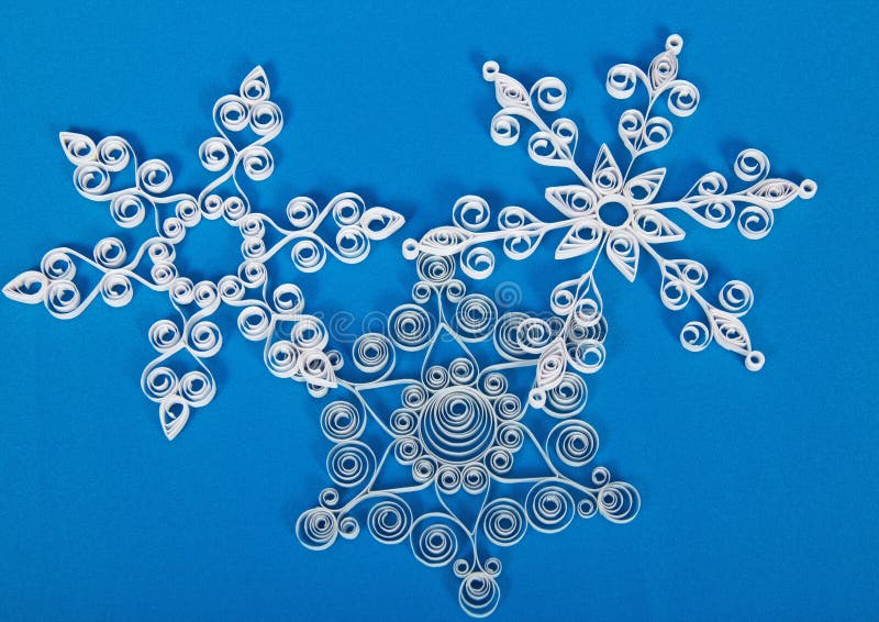 Three paper Christmas snowflakes, hand made.