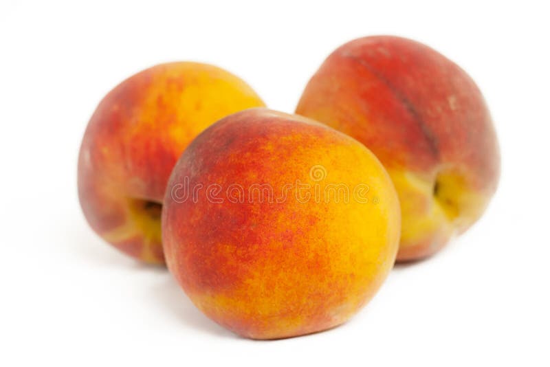 Three peaches isolated