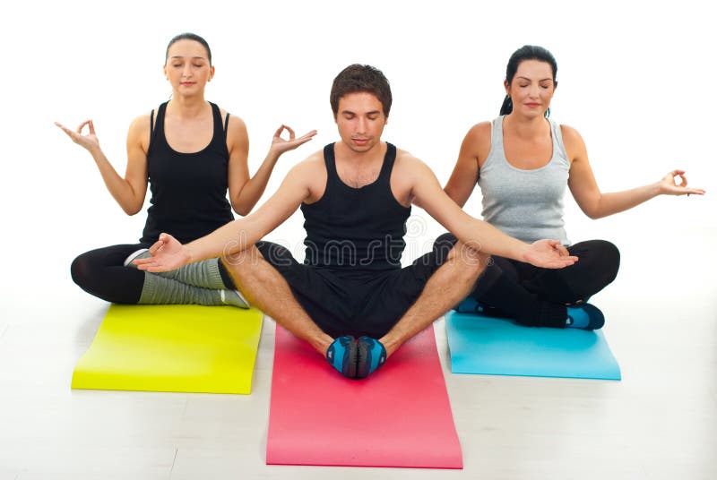 Three people doing yoga royalty free stock images