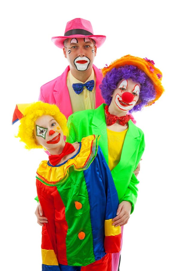 Three People Dressed Up As Colorful Funny Clowns Stock Photo - Image of