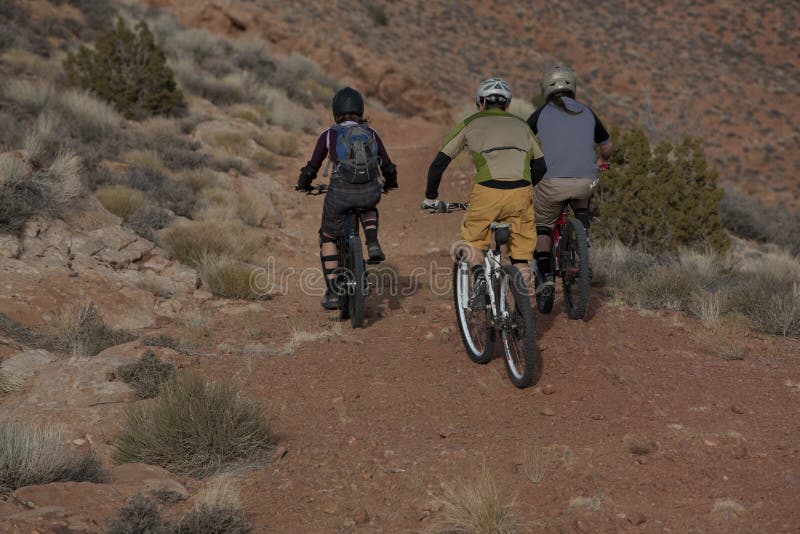 Three People Riding Mountain Bikes Stock Image Image of riding, ride
