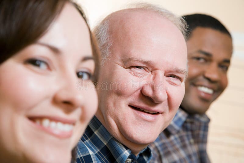 Three people smiling royalty free stock images