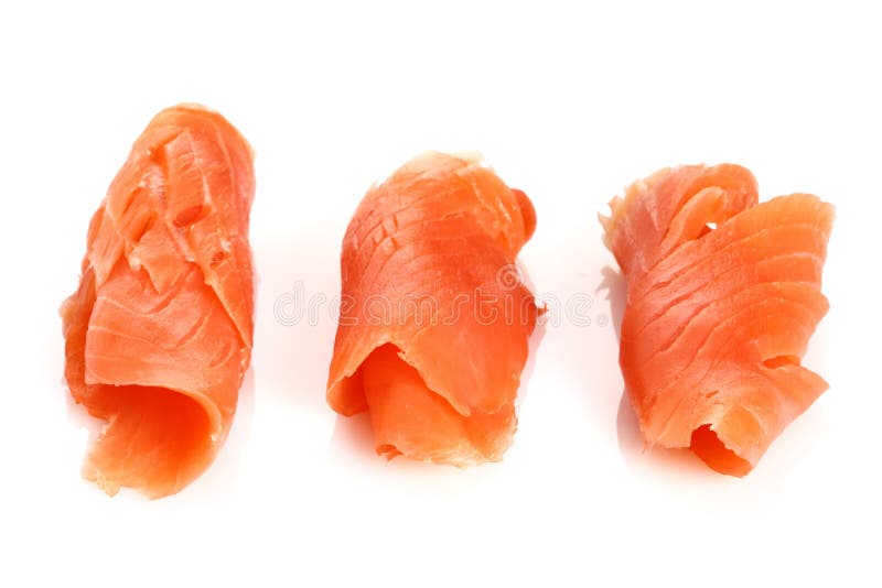 Three pieces of smoked salmon on white