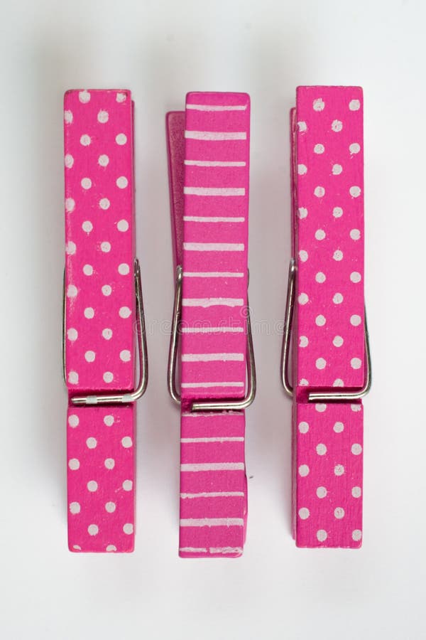 Two Pink Clothes Pins with Fun Patterns Flipped Top View Stock Photo