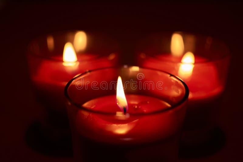 Some burning red candles stock photo. Image of religious - 182501216