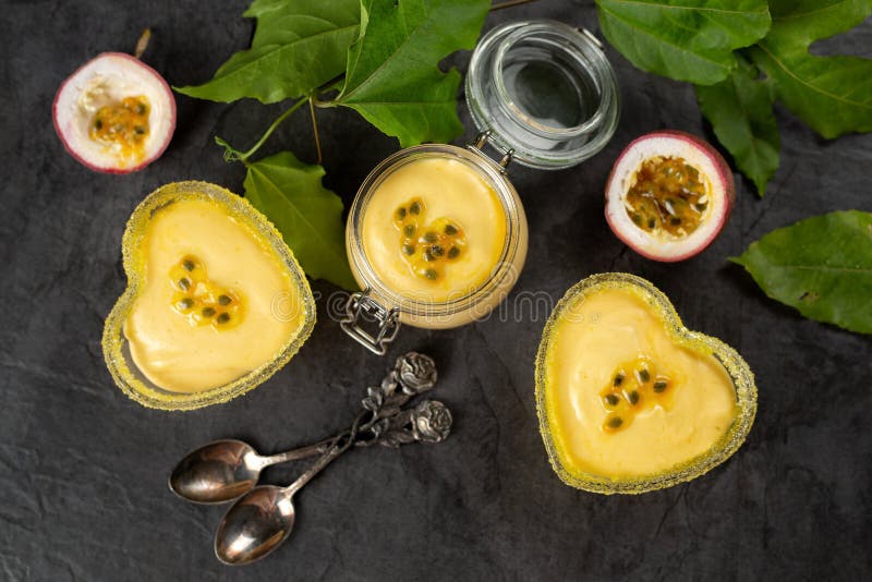 Three Ramekin with Passion Fruit Mousse on Dark Background, Top Stock