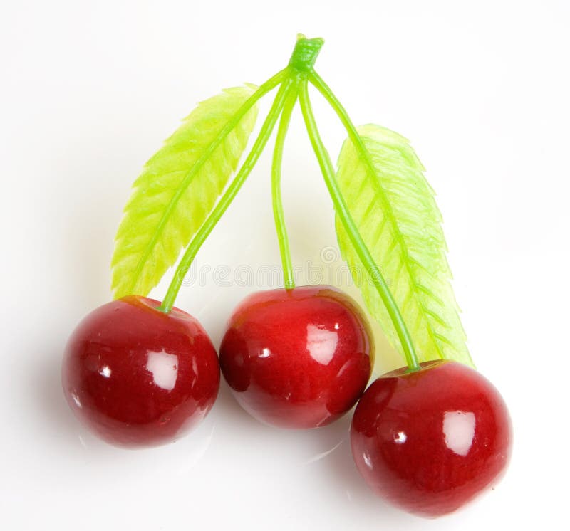 Three red cherries royalty free stock images