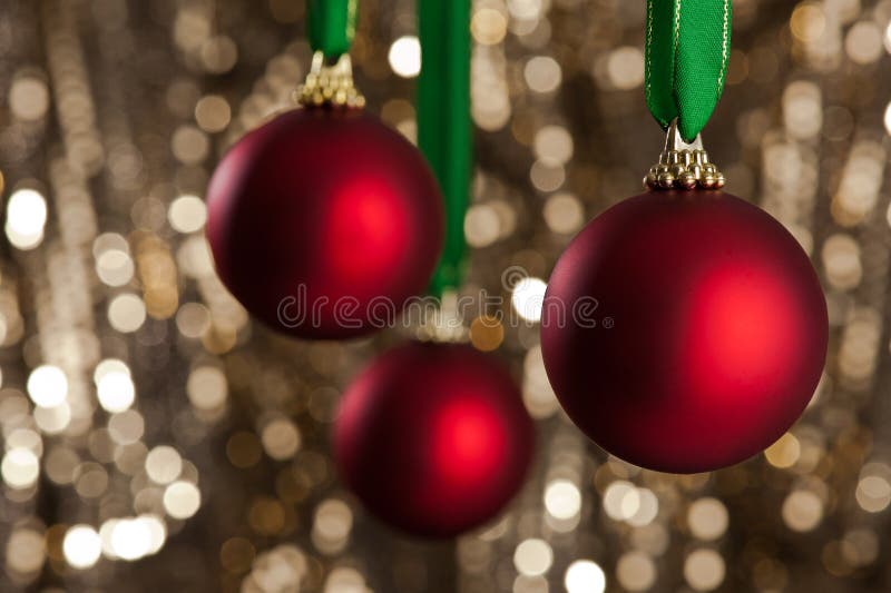 Three red Christmas baubles