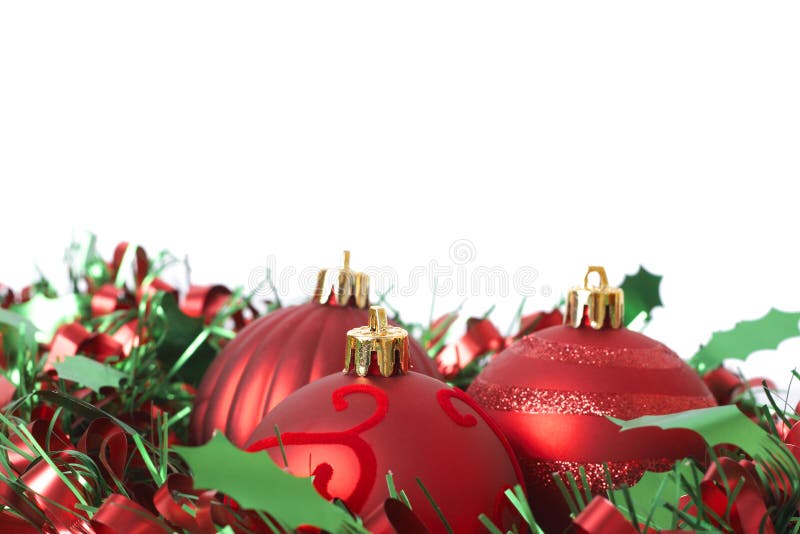 Three Red Christmas baubles on tinsel