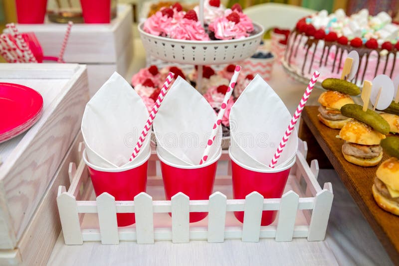 Three red paper cups on the party table