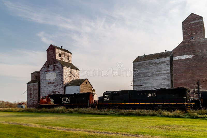 Three red and white grain eleavotrs and trains. Waseca, Saskatchewan, Canada