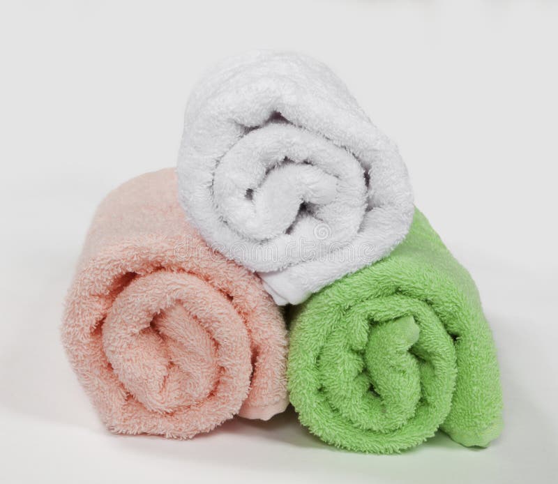 Three Rolled Bath Towels stock photo. Image of roll, bath 32748368
