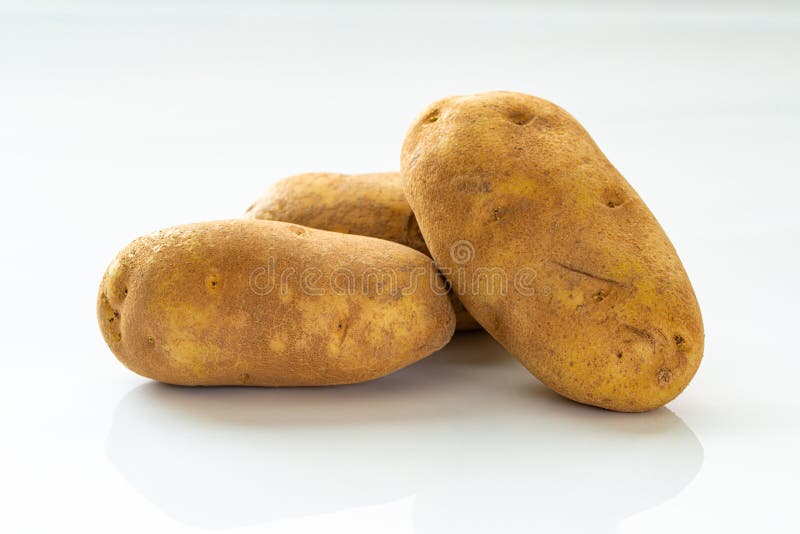 Three Raw Russet Potatoes Stock Photos Free & RoyaltyFree Stock