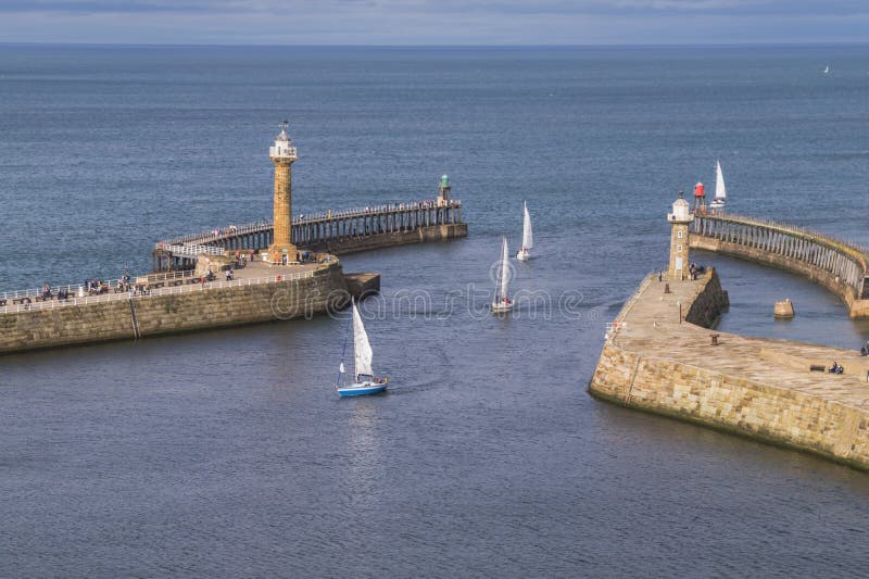 Sailing boats entering the harbour at Whitby