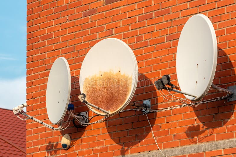 Three Satellite Dishes on the Wall Stock Image Image of architecture