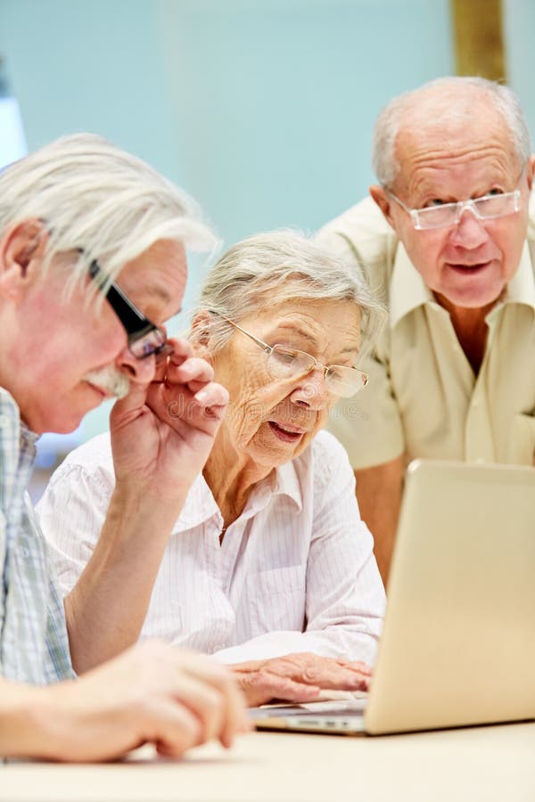 Three Seniors Are Learning Concentrated At The Laptop PC Stock Photo ...