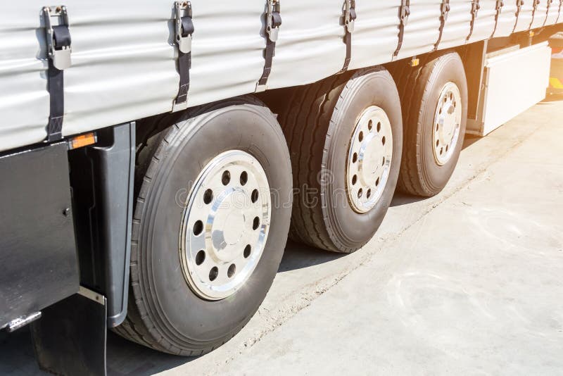 Three Shiny Chrome Wheel of Large Truck and Trailers Stock Image