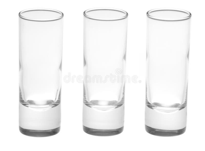 The Three Shot Glasses Lined Up in a Dark Area with Orange Bogies