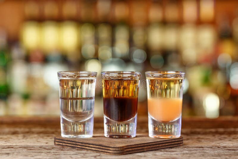 Three Shots Cocktail on the Bar Stock Photo - Image of orange, glass ...