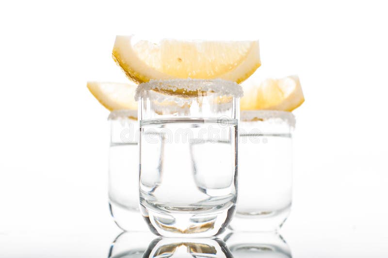 Three Shots of Vodka with Lime Slice Stock Photo - Image of tequila ...